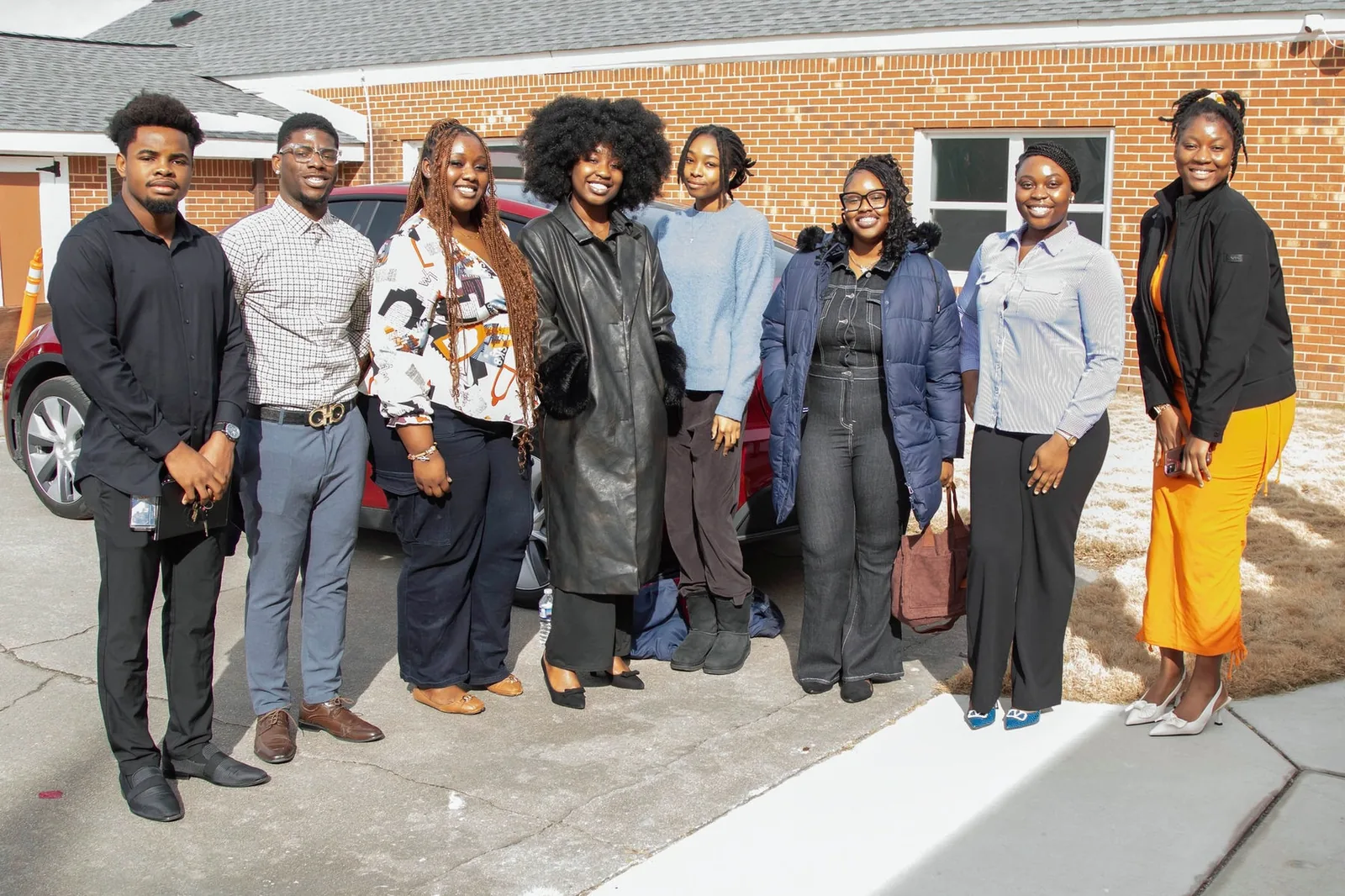 Members of the Living Destiny Church community together after a service